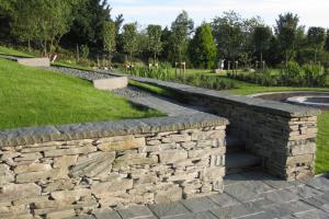 Traditional stone walls & slate paved patio