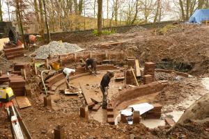 Building the blockwork walls of the pond.