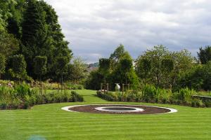 This planting draws your attention, with the backdrop of pleached trees separati