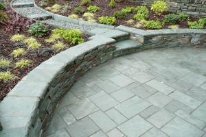 This small patio is stylish with its curved walls creating a perfect place to re