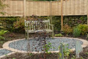 A circular seating area which in time will become surrounded by shrubs and peren