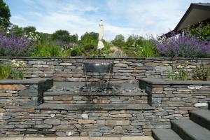 Water cascade with local slate walls