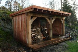 The oak framed timber shed built back in to the quarried side